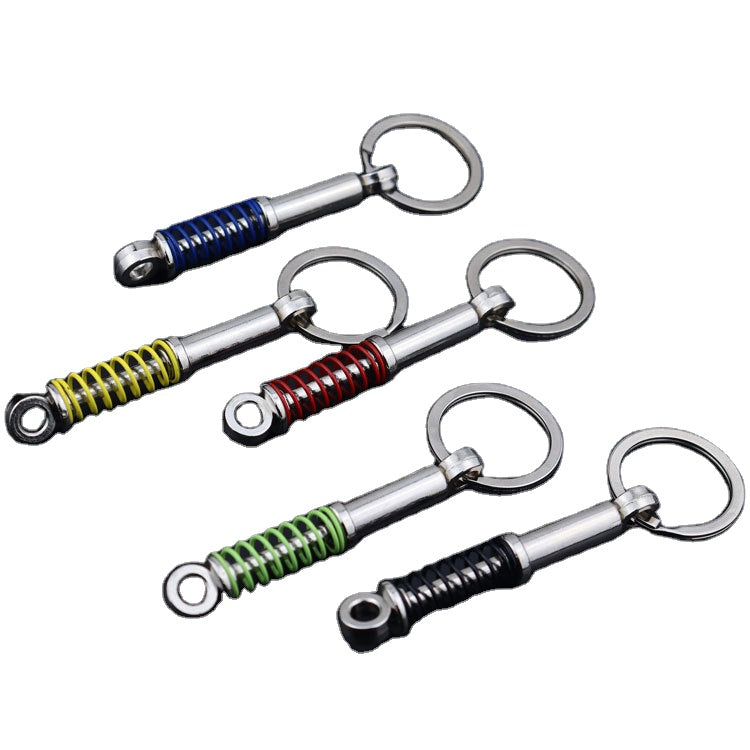 Creative Metal Shock Absorber Keychain – Unique Car Mod Gift for Auto Enthusiasts