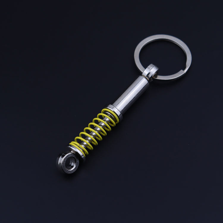Creative Metal Shock Absorber Keychain – Unique Car Mod Gift for Auto Enthusiasts